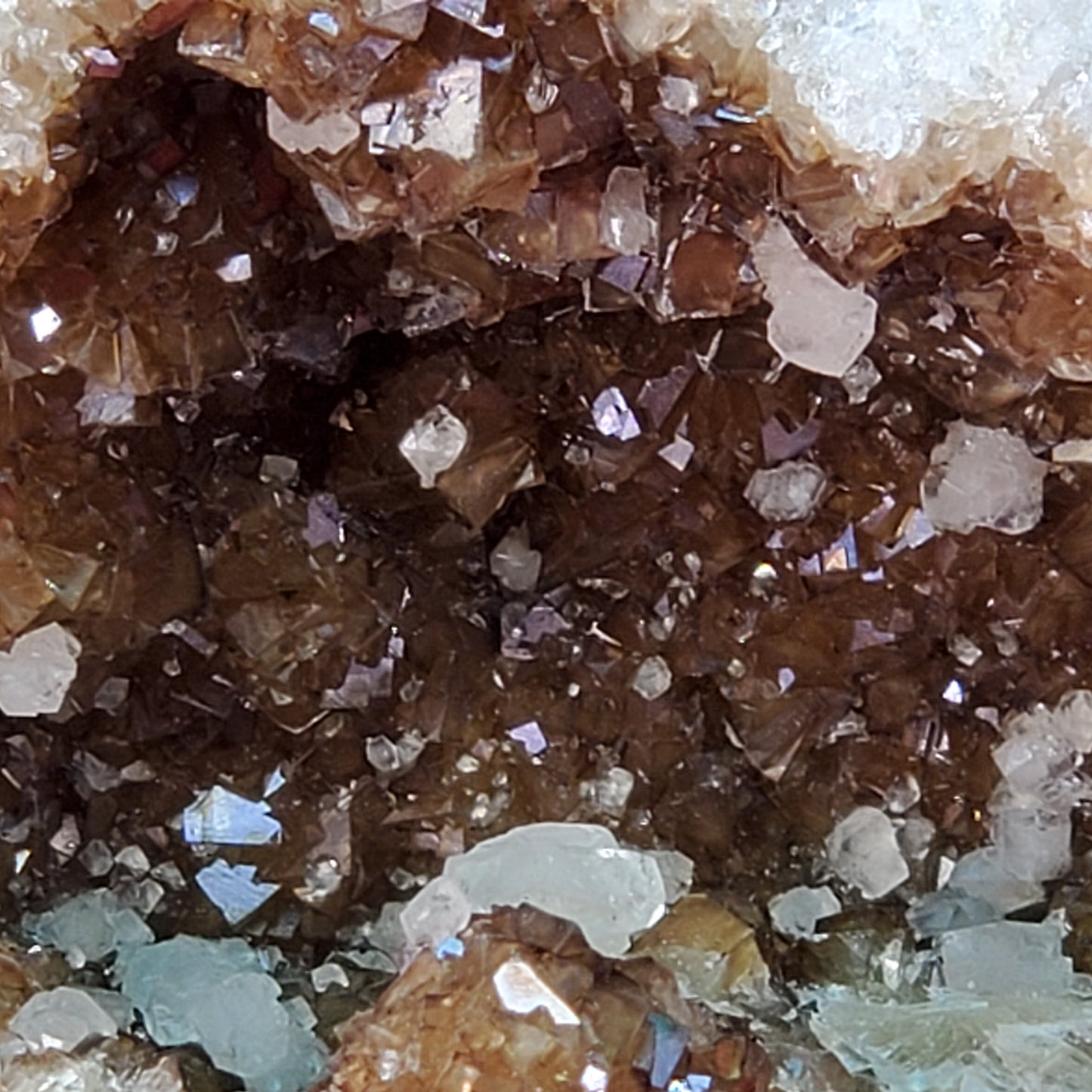 UV reactive iridescent brown calcite geode piece