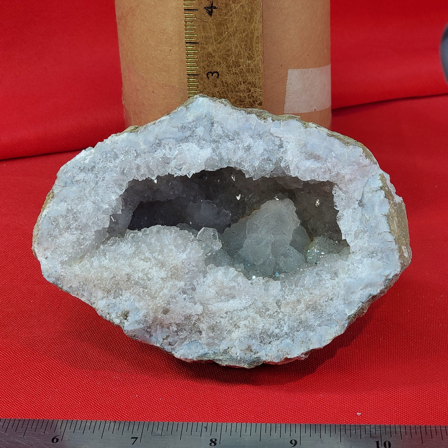 Geode set with quartz, calcite, barite and pyrite.